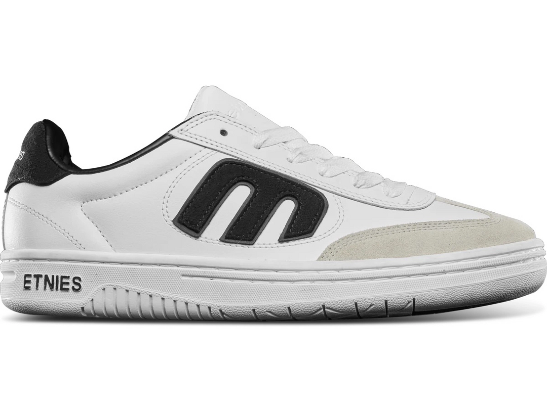 etnies Lowcut Shoe in white and black with suede and mesh upper, triple “E” logo, exposed EVA midsole, and gum outsole with Maze tread.