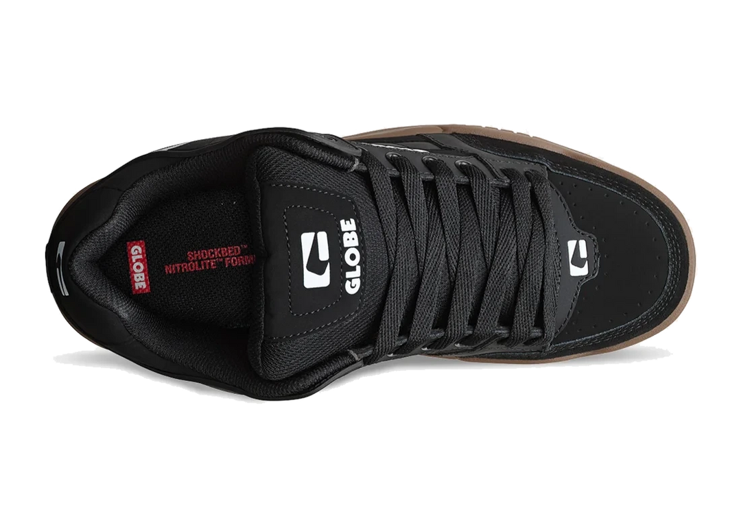 Black sneaker with visible Globe branding on a white background