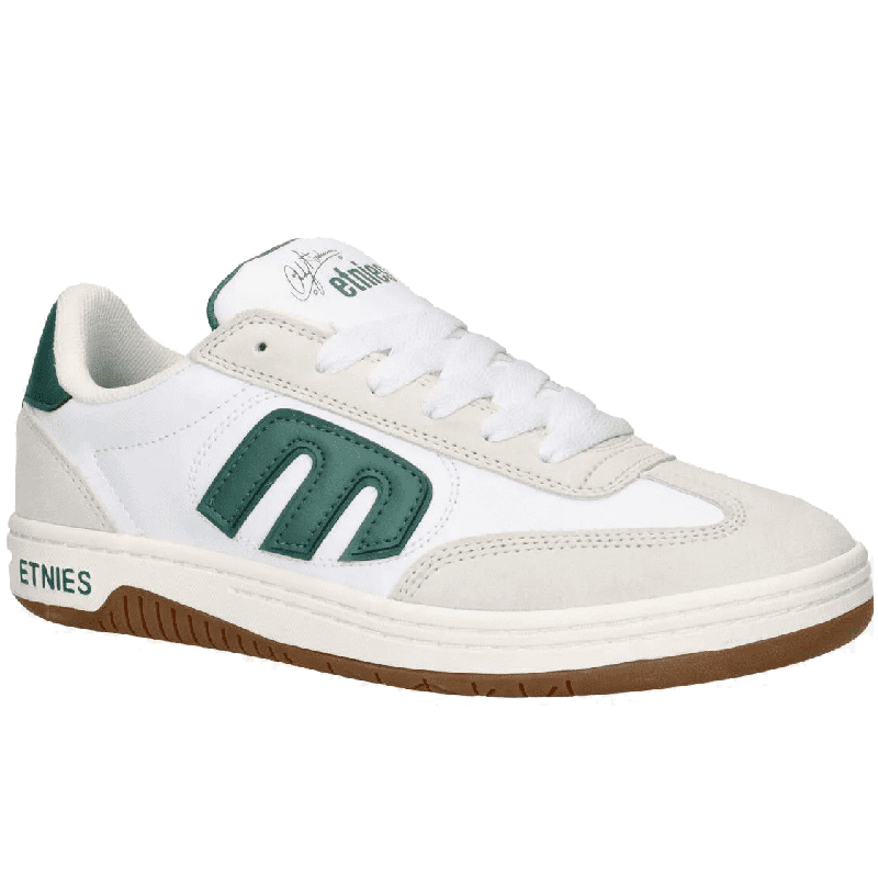 A white low-top sneaker by Ethnies, featuring a prominent green 'm' logo on the side, a green heel tab, and a brown gum sole.
