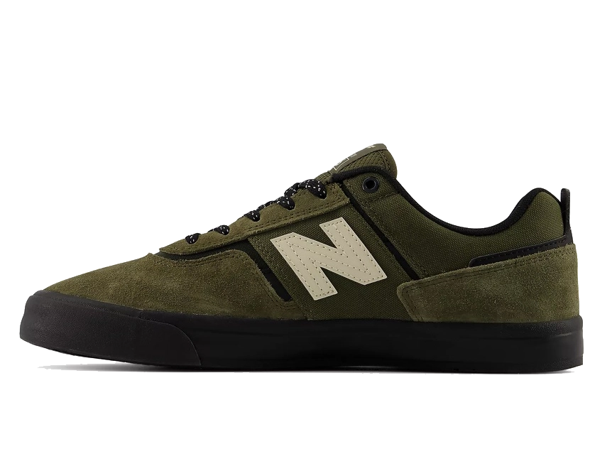 An olive green New Balance sneaker with a black sole and laces, featuring the signature beige 'N' logo on the side, shown against a plain white background.