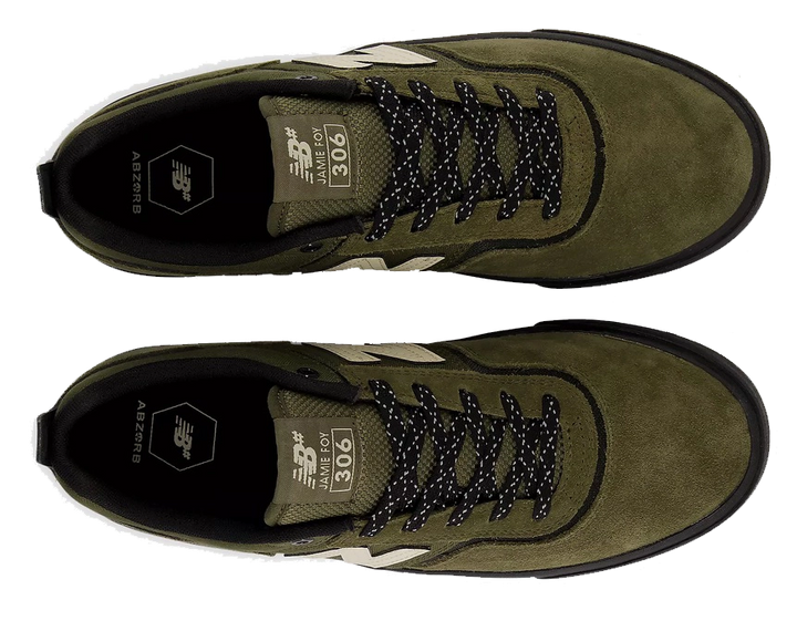 A pair of New Balance 906 low-top sneakers in olive green suede and mesh, featuring black speckled laces, black soles, and beige side stripes, shown from a top-down view on a white background.