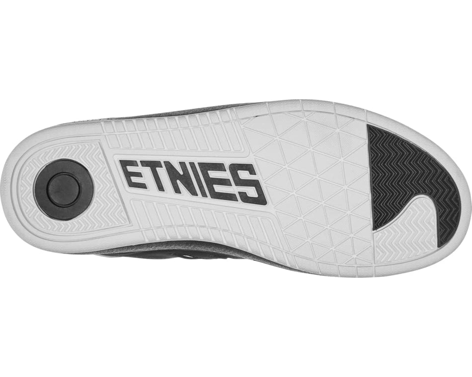 White shoe sole with black 'ETHNIES' logo on a white background