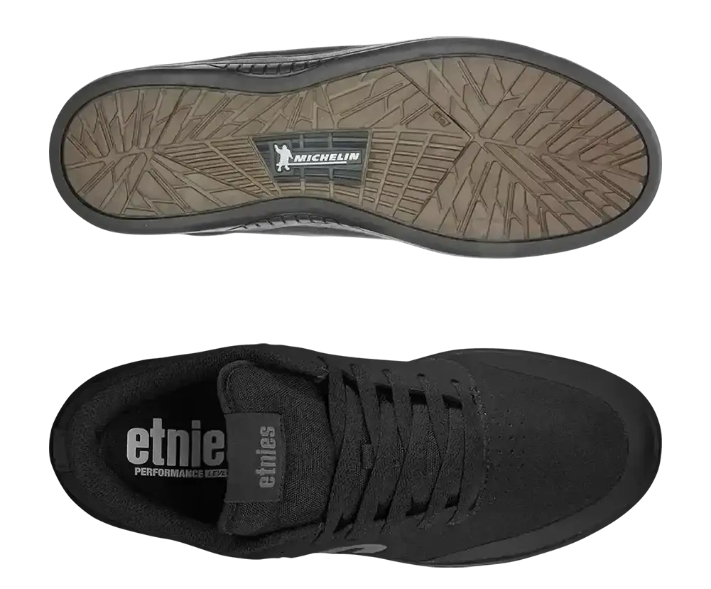 Black Etnie skate shoe shown from the top and bottom views, featuring a textured brownish-gray Michelin sole and a black interior with white Etnie branding.
