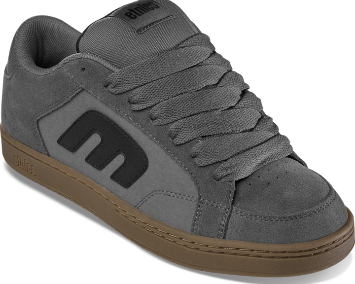 Gray sneaker with brown sole on a white background