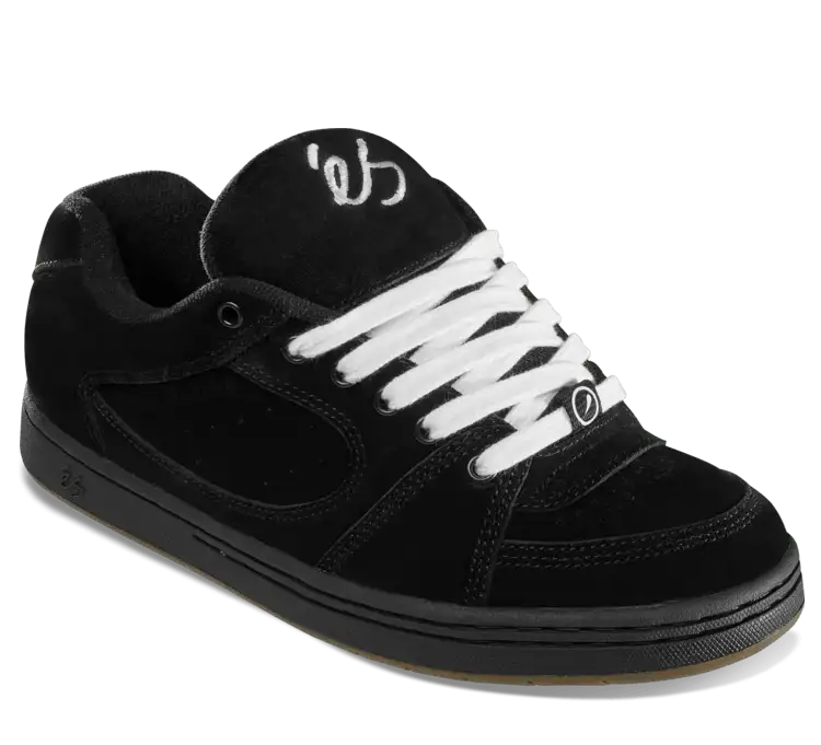A black suede skate shoe with white laces and a white stylized logo on the tongue, shown from a three-quarters angle on a white background.