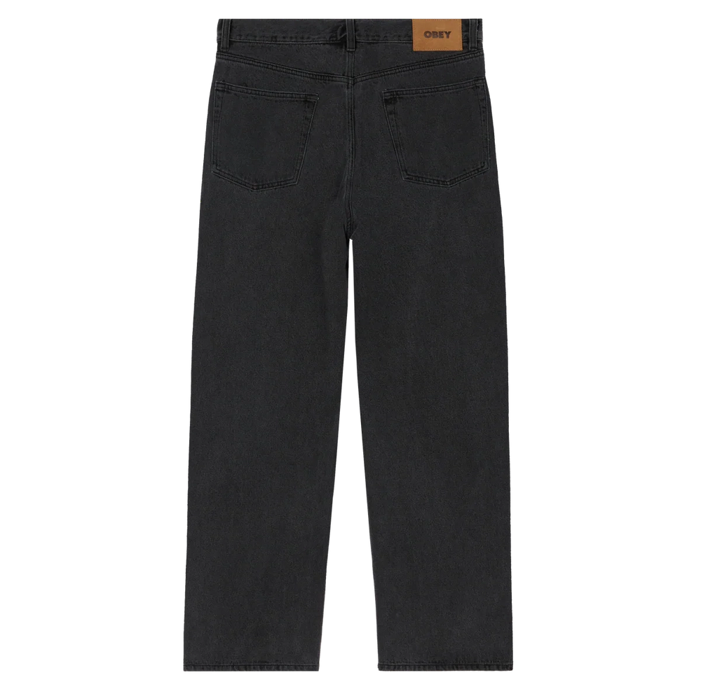 Black jeans with a visible brand label on a white background