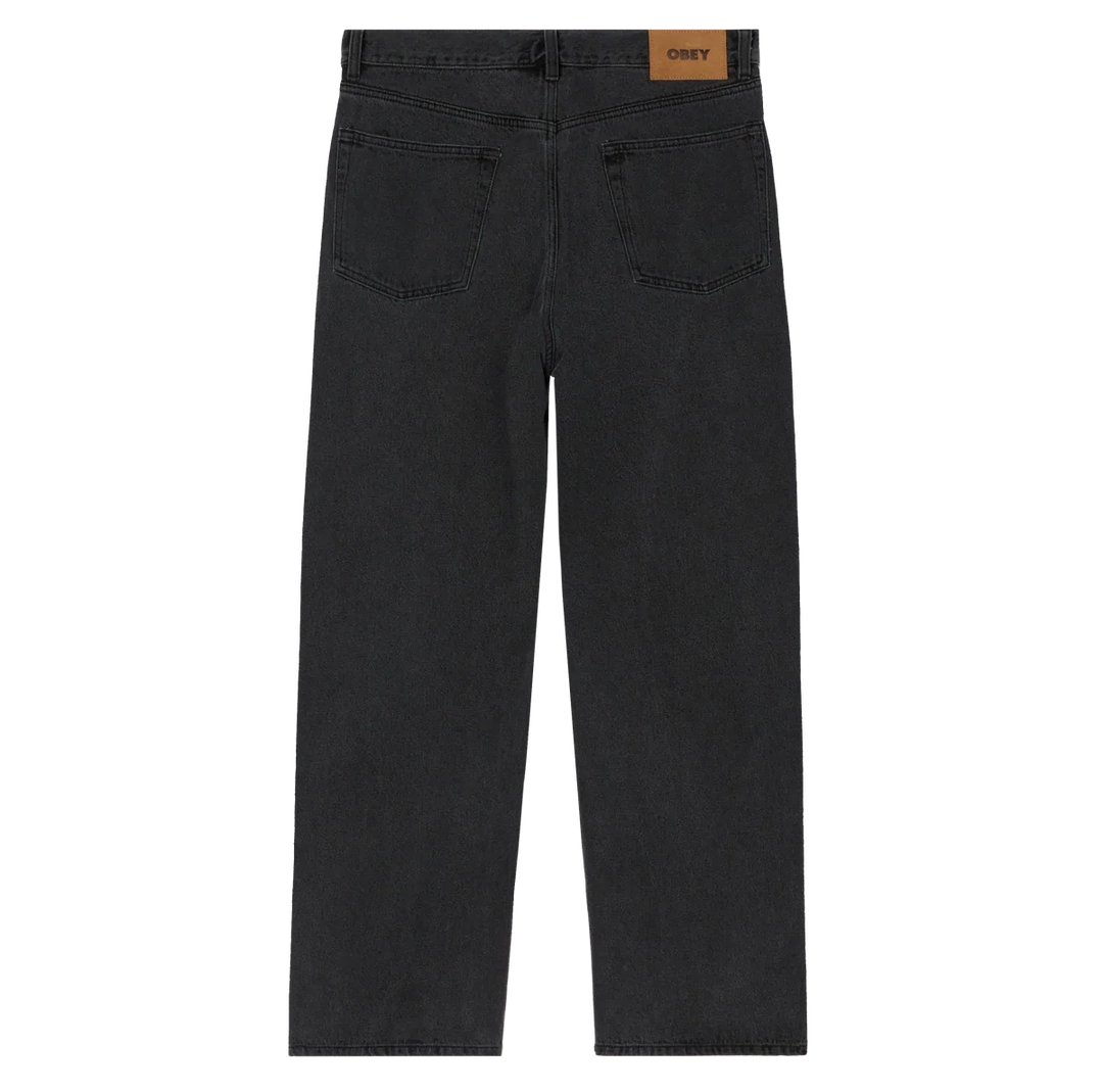 Black jeans with a visible brand label on a white background