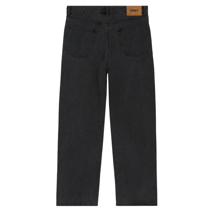 Black jeans with a visible brand label on a white background