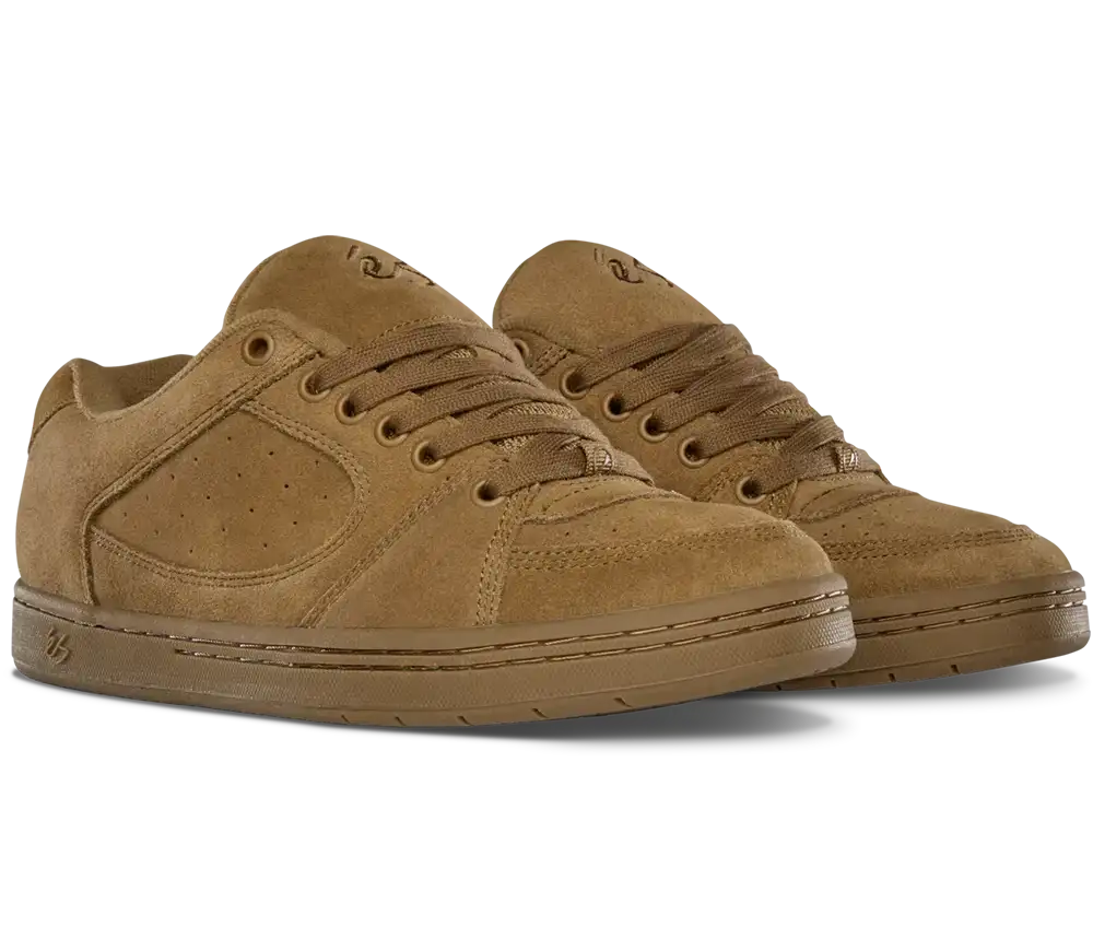 A pair of low-top suede sneakers in a monochromatic tan-brown colorway, featuring a matching suede toe cap, perforated side panels, and tonal laces, shown against a plain white background.