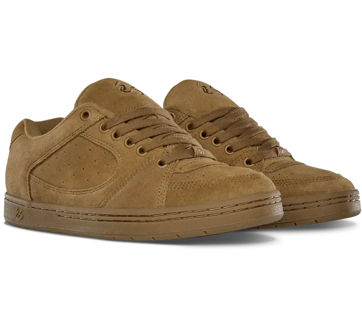 A pair of low-top suede sneakers in a monochromatic tan-brown colorway, featuring a matching suede toe cap, perforated side panels, and tonal laces, shown against a plain white background.