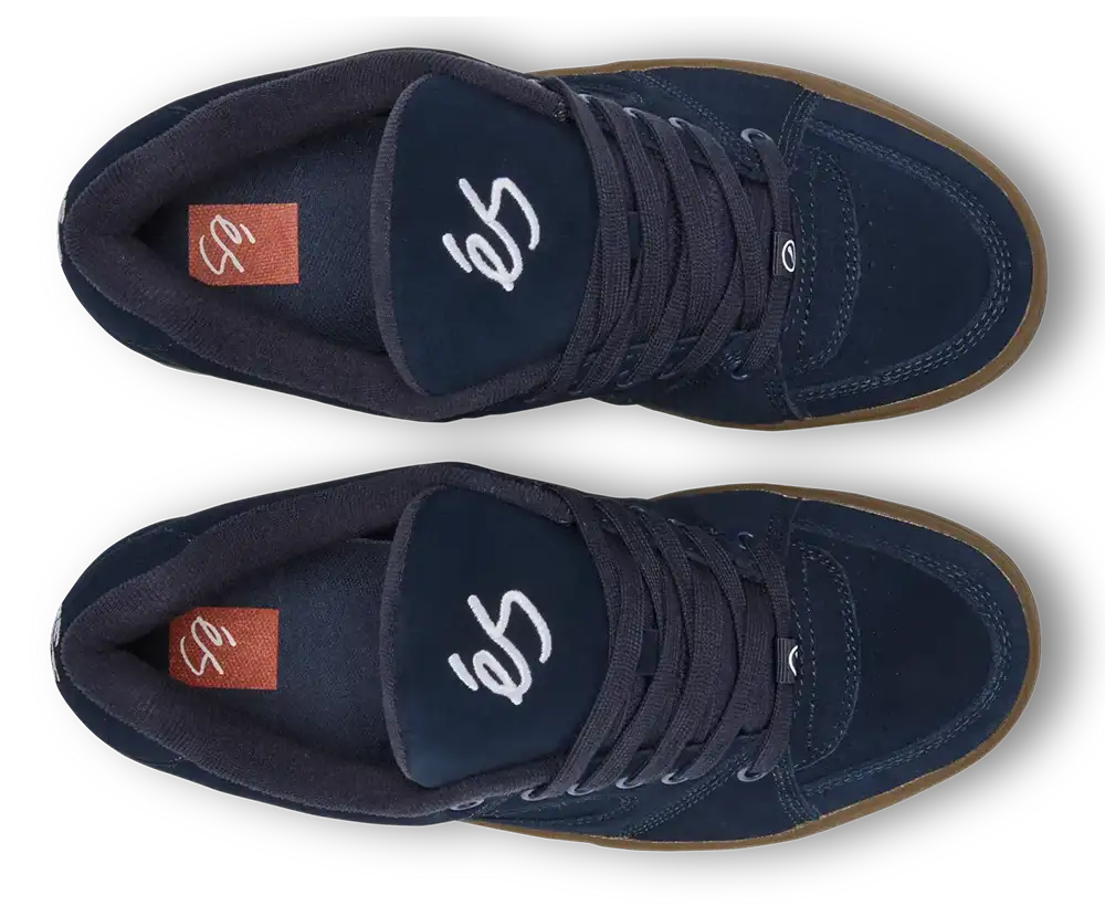 A pair of dark navy blue suede high-top sneakers shown from a top-down view on a white background. The shoes feature white script lettering on the tongue, a brown gum sole, and a small orange brand tag on the heel.