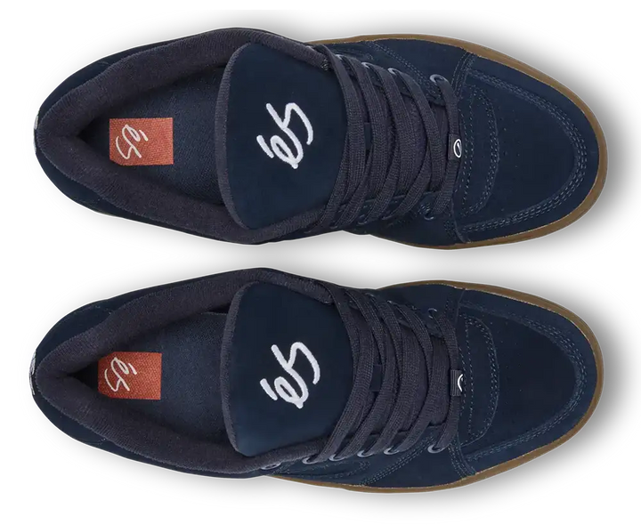 A pair of dark navy blue suede high-top sneakers shown from a top-down view on a white background. The shoes feature white script lettering on the tongue, a brown gum sole, and a small orange brand tag on the heel.