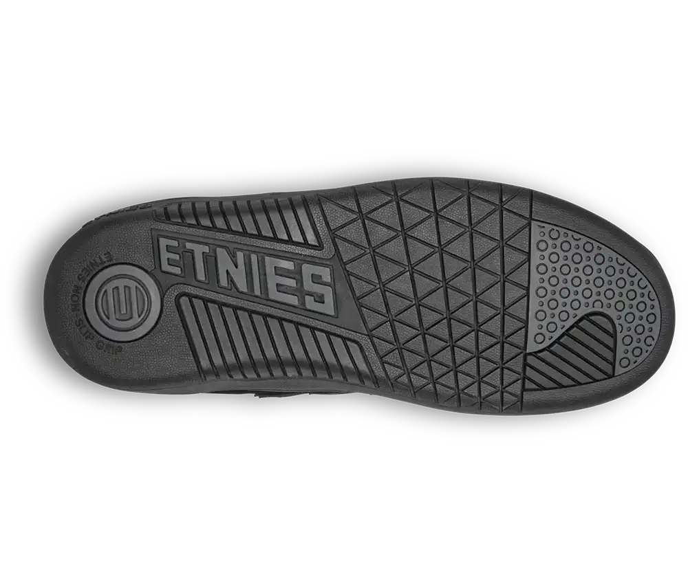 The black rubber outsole of a shoe, featuring the embossed brand name 'ETNIES' and a textured geometric tread pattern, shown against a plain white background.