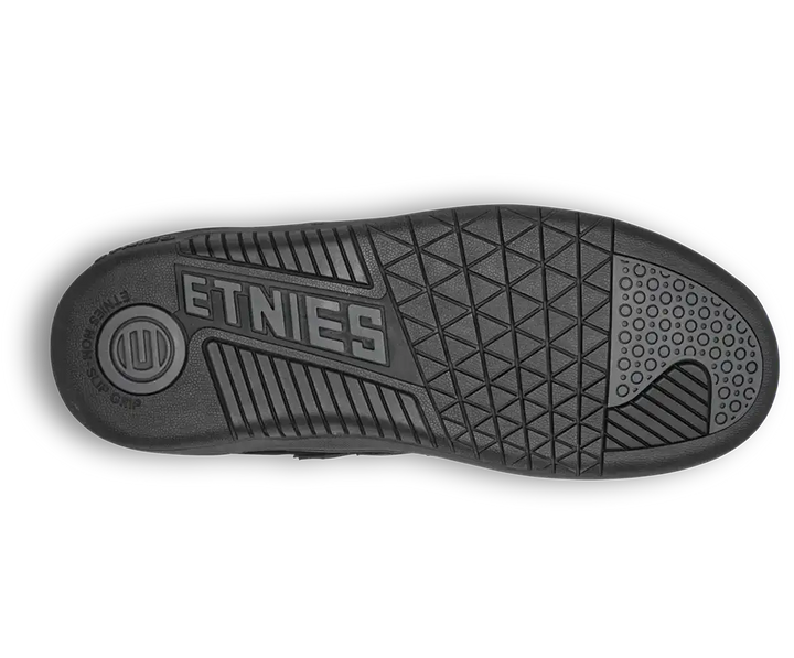 The black rubber outsole of a shoe, featuring the embossed brand name 'ETNIES' and a textured geometric tread pattern, shown against a plain white background.