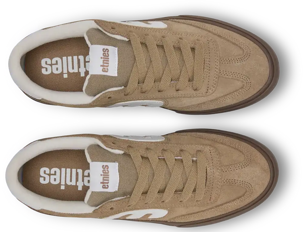 A pair of Ethniles suede sneakers in a warm tan/beige colorway, shown from a top-down view. The shoes feature matching beige laces, a white leather tongue label with the brand name 'ethniles', a brown midsole, and a white collar lining.