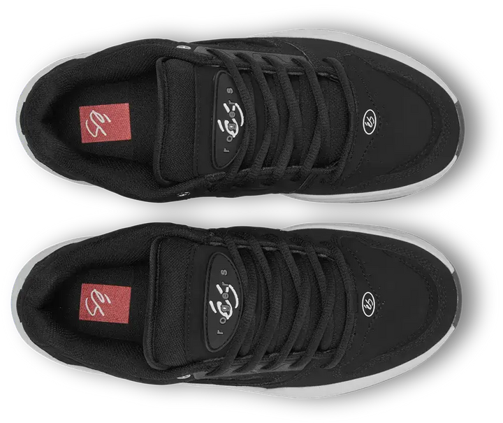 A pair of black low-top skate shoes shown from a top-down view on a white background. The shoes feature black laces, a black mesh and synthetic upper, a red insole logo patch, and a white midsole.