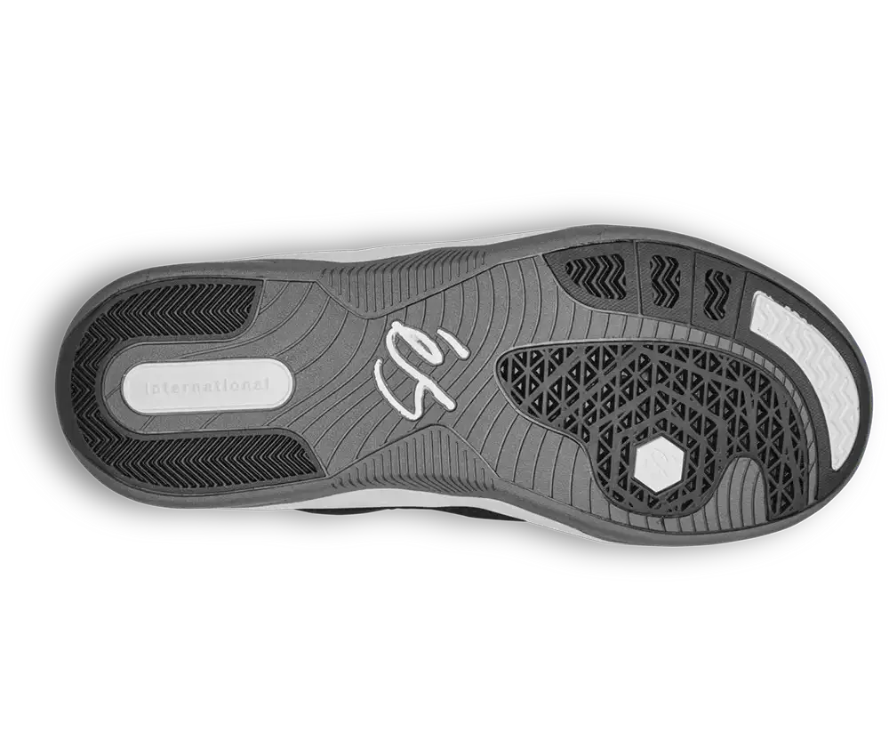 The outsole of a shoe shown from a top-down view, featuring a dark gray and black tread pattern with a white signature logo in the center and the word 'International' on the heel.