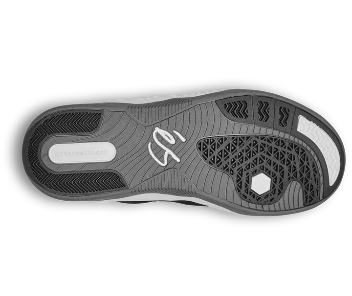 The outsole of a shoe shown from a top-down view, featuring a dark gray and black tread pattern with a white signature logo in the center and the word 'International' on the heel.