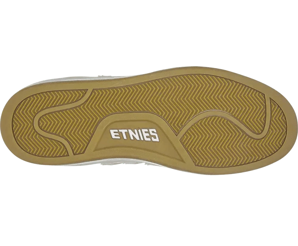 Close-up of a shoe sole with 'Etnies' branding on a white background