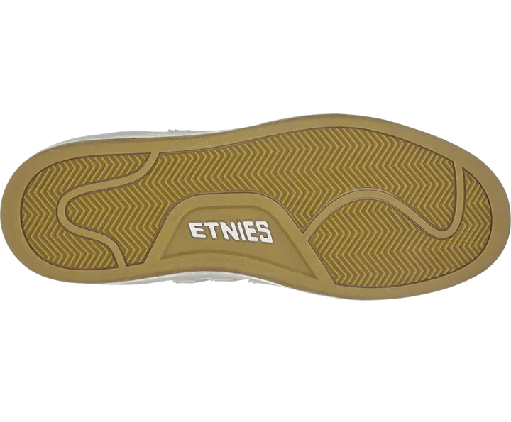 Close-up of a shoe sole with 'Etnies' branding on a white background