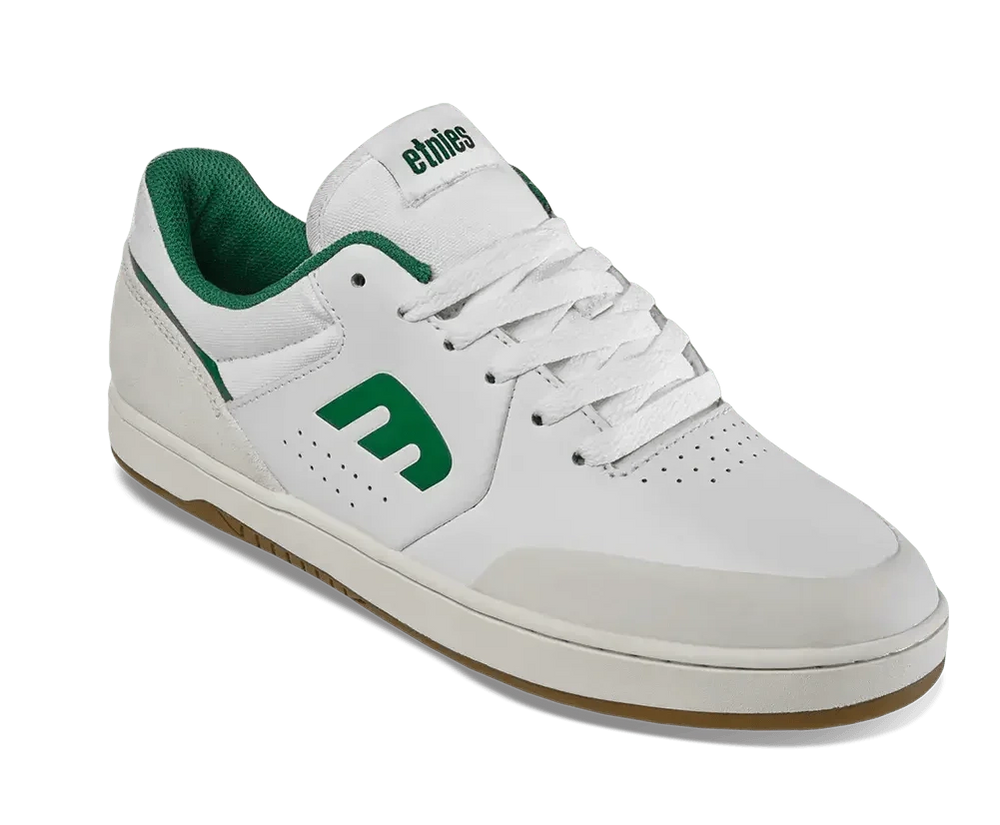 White sneaker with green accents on a white background