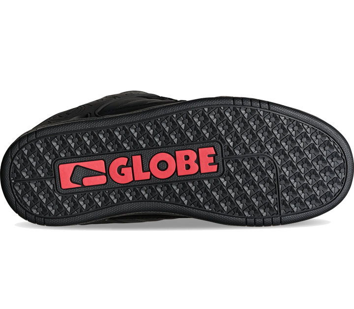 The black textured rubber outsole of a shoe, featuring a prominent red and black GLOBE logo on the heel, shown against a plain white background.