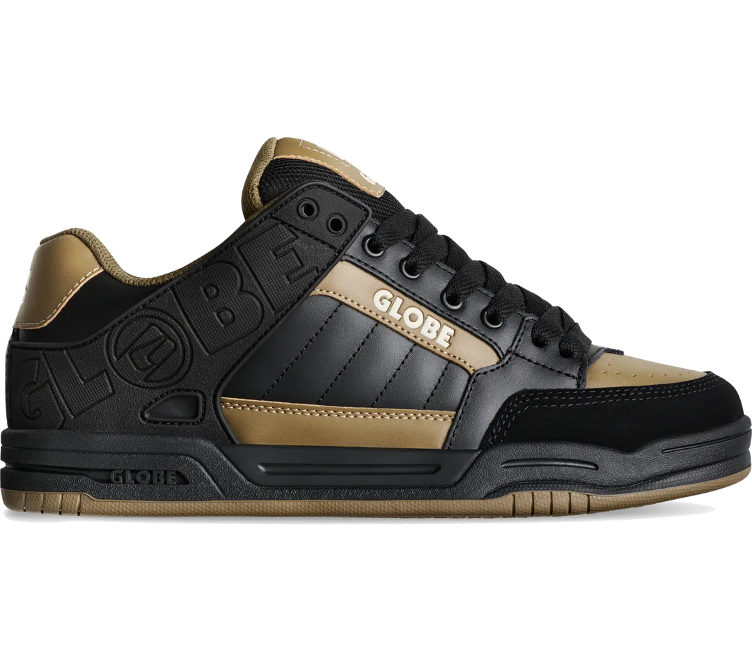 A low-top sneaker in black and gold, featuring a black leather upper with gold suede panels, black laces, and 'GLOBE' branding on the side and heel.