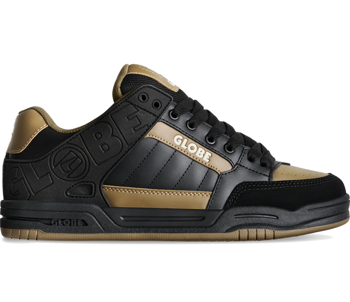 A low-top sneaker in black and gold, featuring a black leather upper with gold suede panels, black laces, and 'GLOBE' branding on the side and heel.