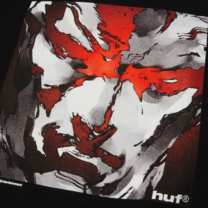 T-shirt with abstract design featuring red, black, and white colors on a dark background.