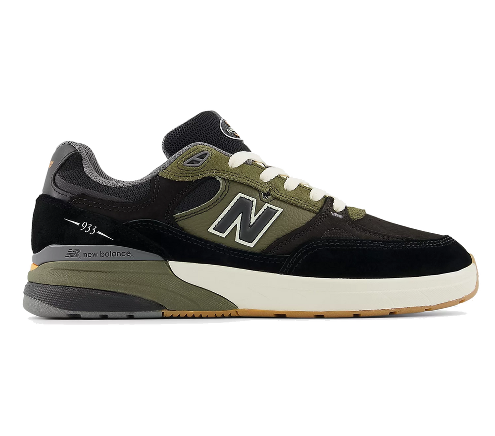 New Balance Numeric 933 Andrew Reynolds shoe in black and dark olive with reinforced toe, cupsole support, and signature pro design.