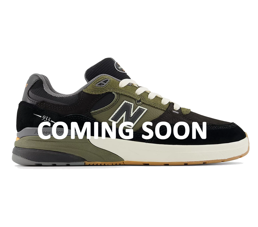 New Balance Numeric 933 Andrew Reynolds skate shoe in black and olive green with “Coming Soon” text overlay for upcoming release.