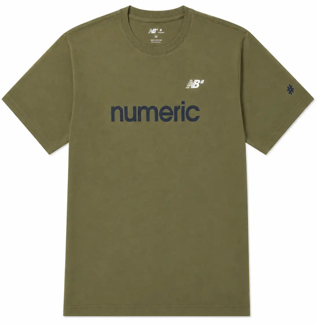 An olive green short-sleeve t-shirt with 'numeric' printed in navy blue across the chest, featuring a white New Balance logo on the left chest and a navy blue logo on the right sleeve, shown on a plain white background.