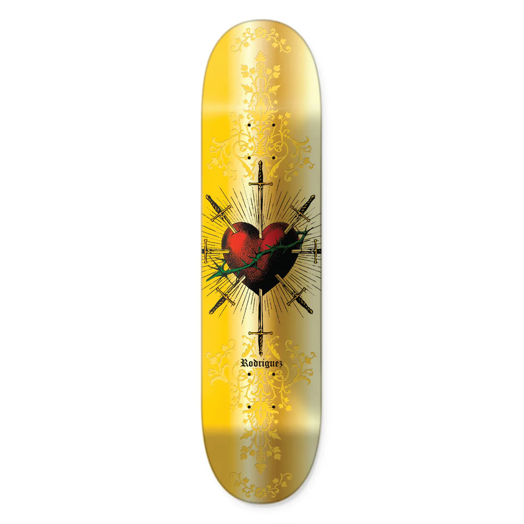Primitive Rodriguez Saint gold foil skateboard deck with heart and sword graphic, 8.25" maple construction.