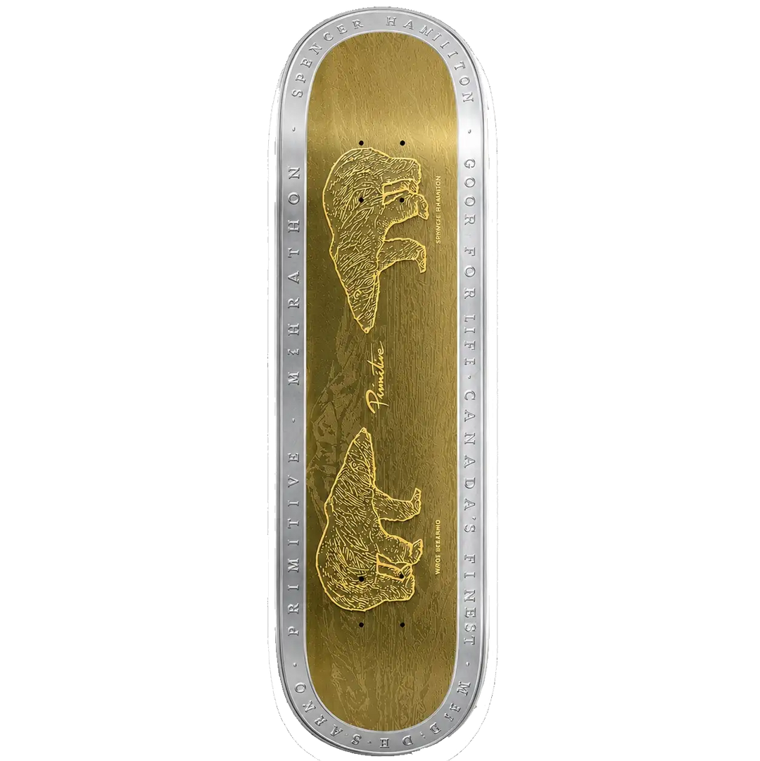 A skateboard deck shown from the top, featuring a metallic gold graphic design with two bear illustrations and silver engraved text around the edge, set against a plain white background.