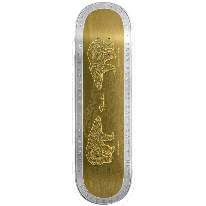 A skateboard deck shown from the top, featuring a metallic gold graphic design with two bear illustrations and silver engraved text around the edge, set against a plain white background.