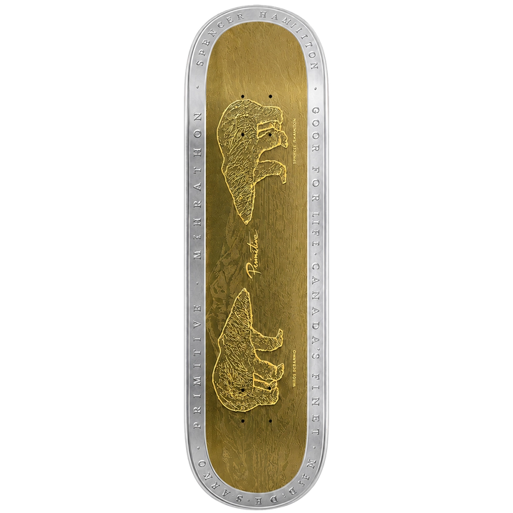 A skateboard deck shown from the top, featuring a metallic gold graphic design with two bear illustrations and silver engraved text around the edge, set against a plain white background.