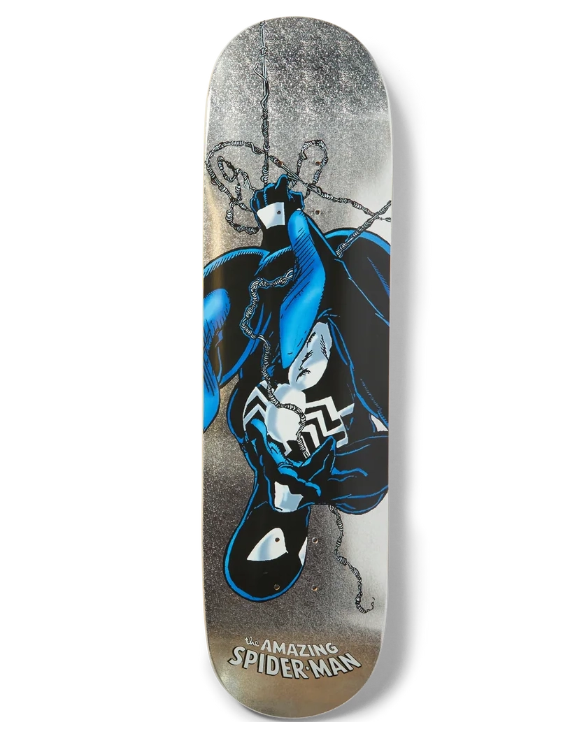 A skateboard deck featuring a graphic illustration of the character Venom in blue and black, set against a distressed gray and brown background with 'The Amazing Spider-Man' text at the bottom.