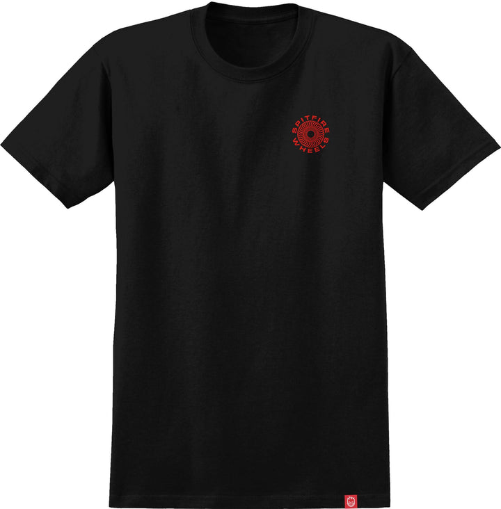 A black short-sleeve crewneck t-shirt with a small red circular graphic on the left chest and a small red tag near the bottom hem, shown on a plain white background.