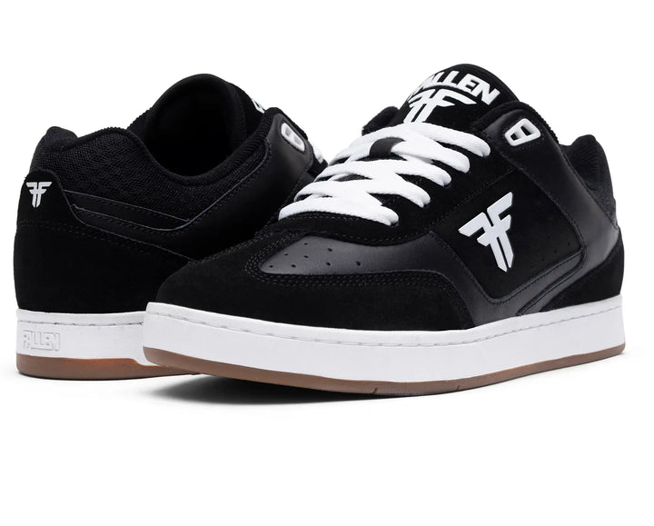 Black and white sneakers with visible branding on a white background