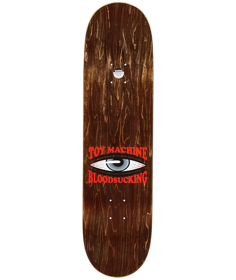 Skateboard deck with 'Toy Machine' and 'Bloodsucking' text on a wooden finish.