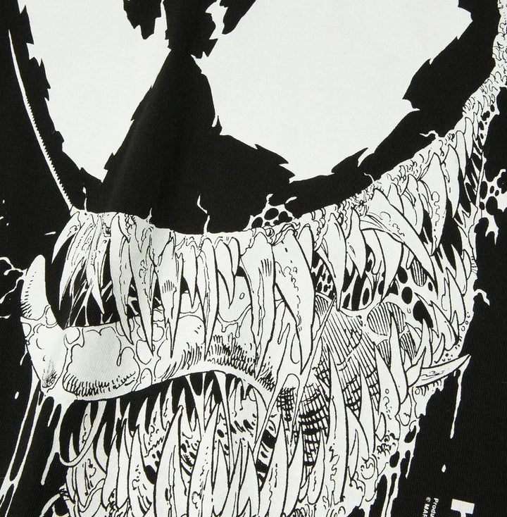 Black and white illustration of Venom's head with detailed patterns on a white background