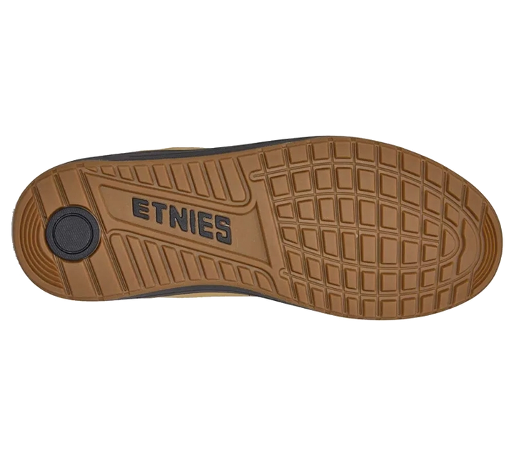 The brown rubber outsole of a shoe, featuring the embossed brand name 'ETNIES' and a textured grid pattern, shown against a plain white background.