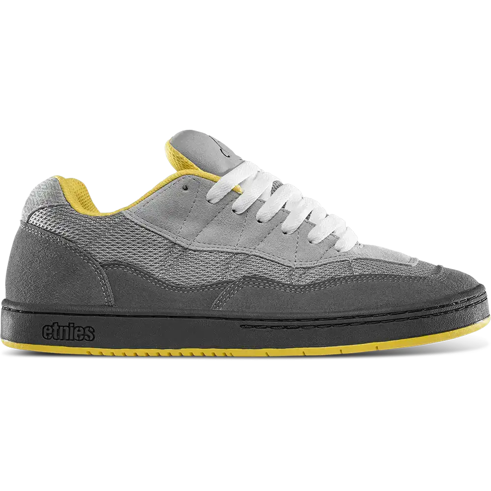 etnies Snake skate shoes in grey and yellow with suede panels, wide fit, and classic 90s low-top design