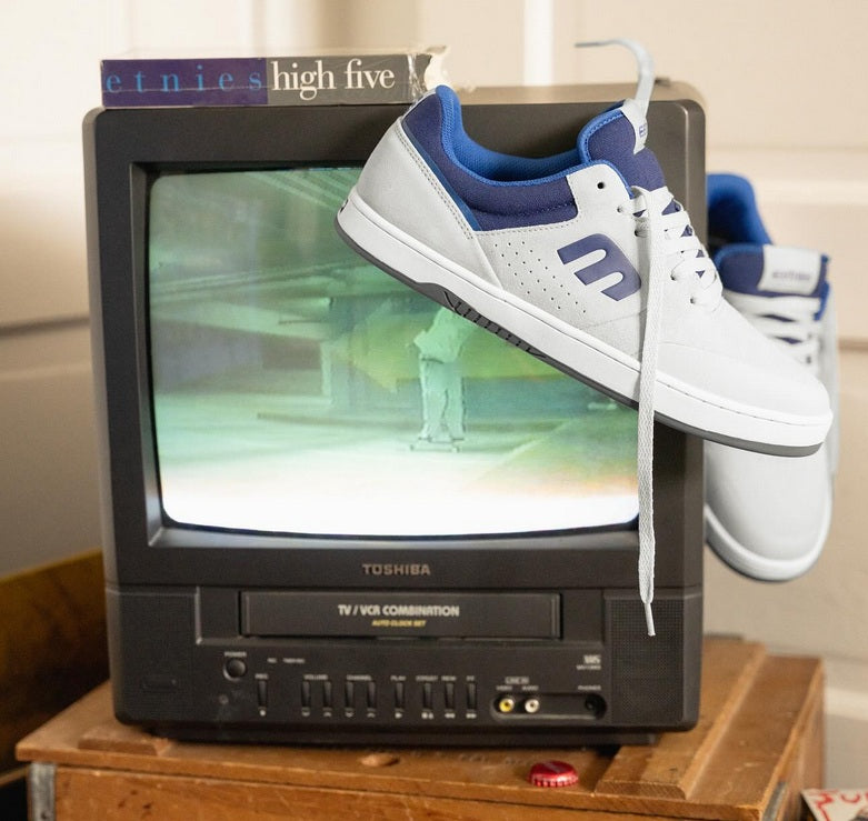Grey etnies marana sneakers with blue accents on an old Toshiba TV displaying etnies high five skate video