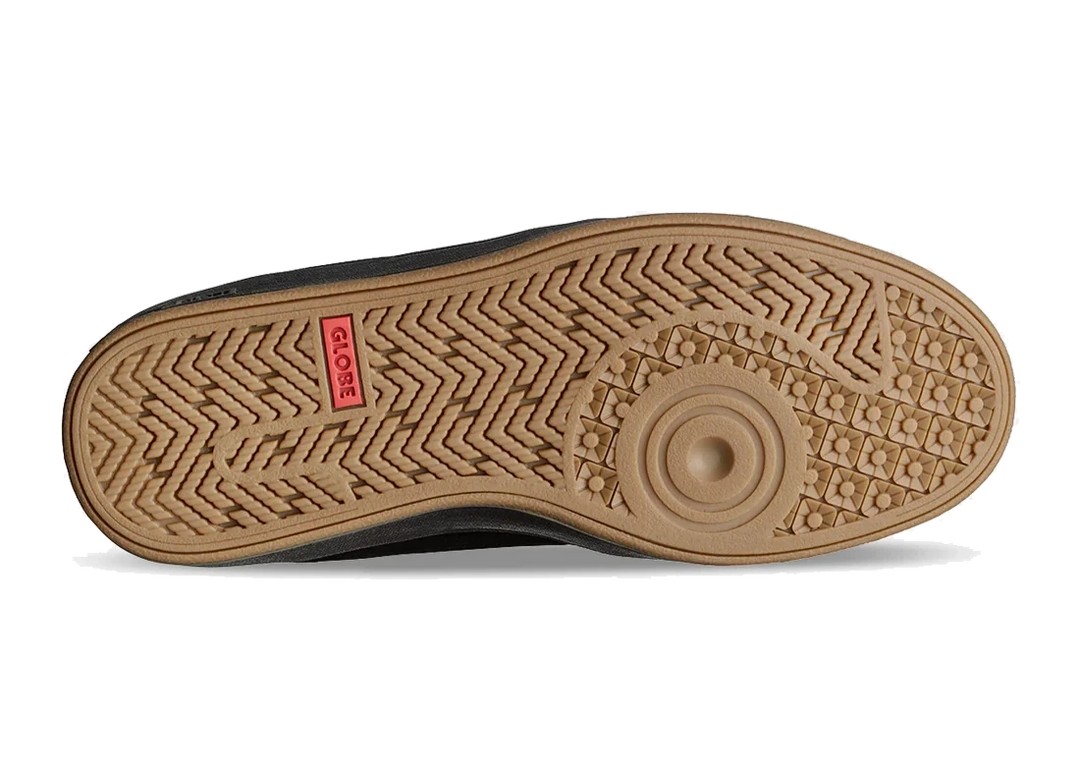 Close-up of a shoe sole with a brand logo on a white background