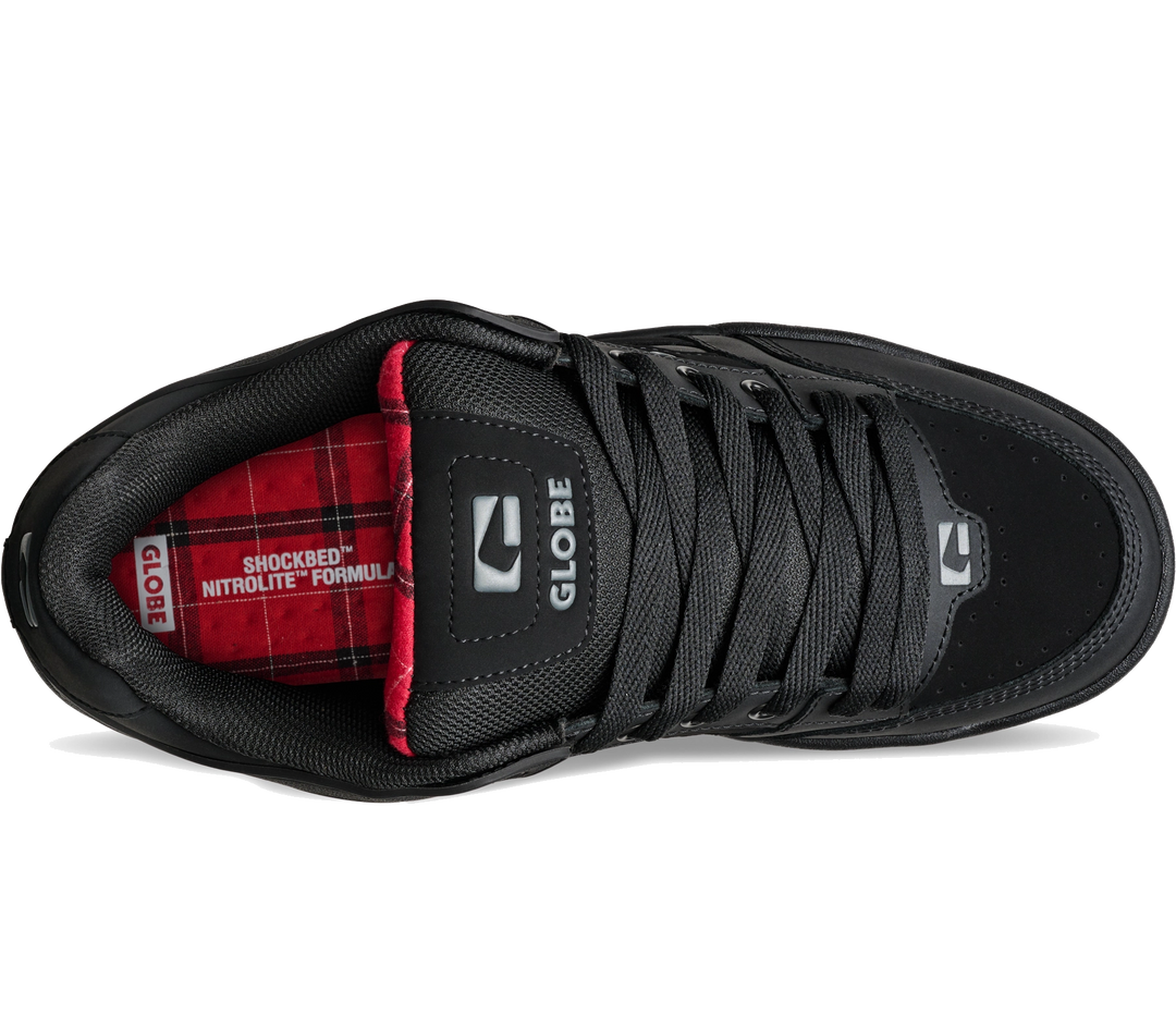 A black low-top sneaker shown from a side profile view on a white background, featuring a red and black plaid interior lining with 'GLOBE' branding.