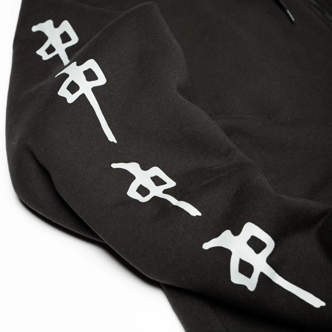 Close-up of a black hoodie sleeve featuring a large white Japanese-style graphic print running down the arm, set against a plain white background.