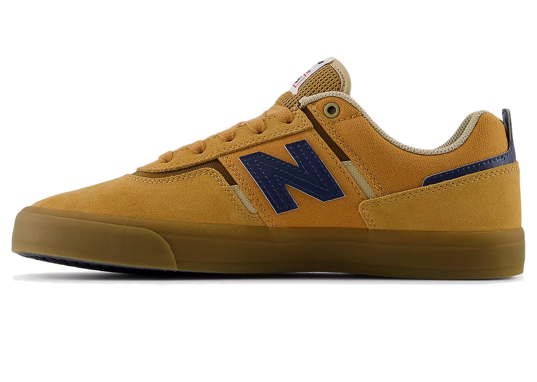 Yellow sneaker with blue 'N' logo on a white background