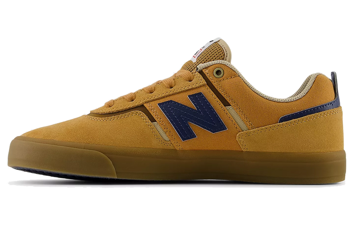 Yellow sneaker with blue 'N' logo on a white background