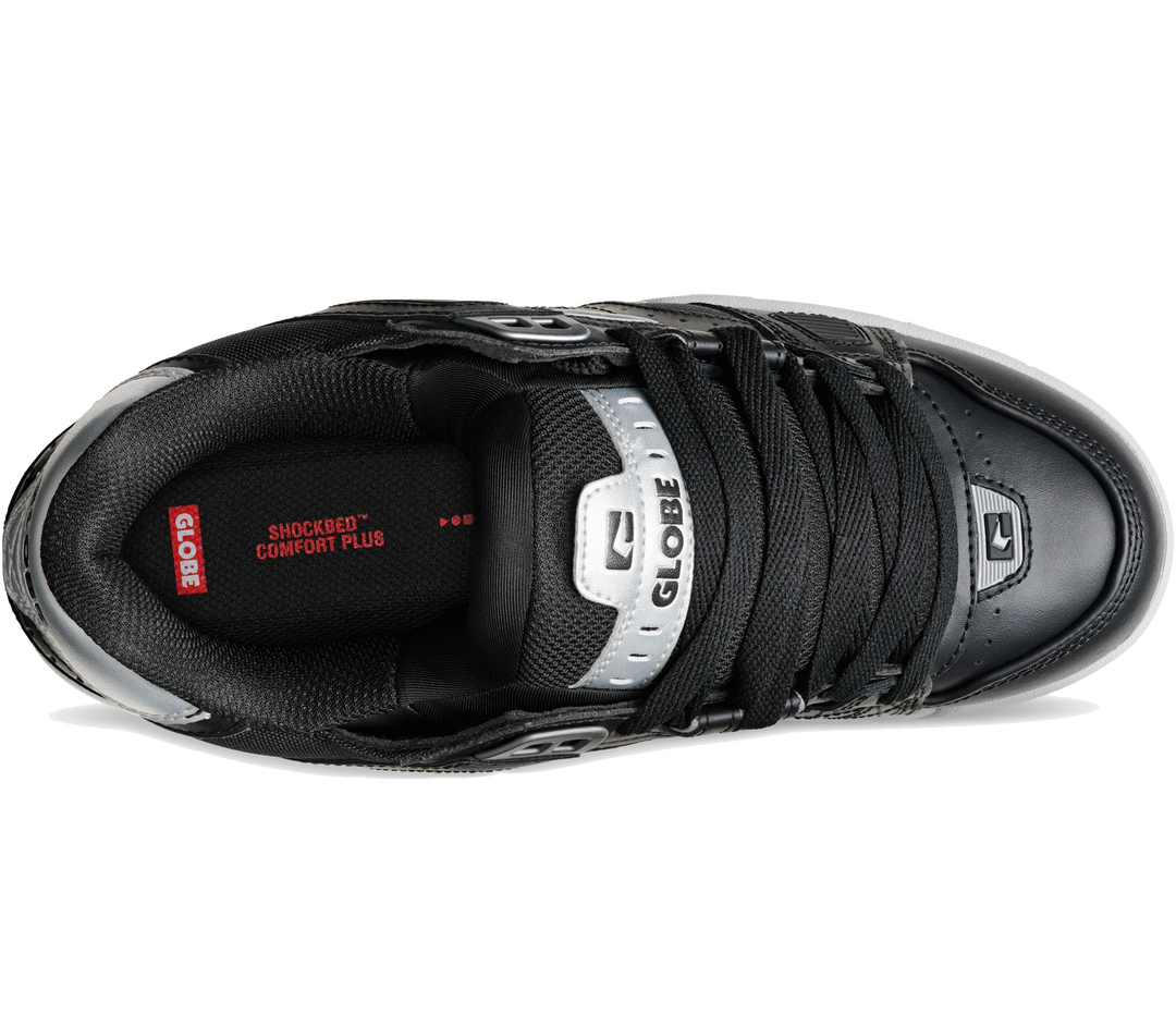 A black GLOBE athletic sneaker shown from a top-down perspective on a white background, featuring black laces, a black mesh and leather upper, a silver tongue label, and red branding details.